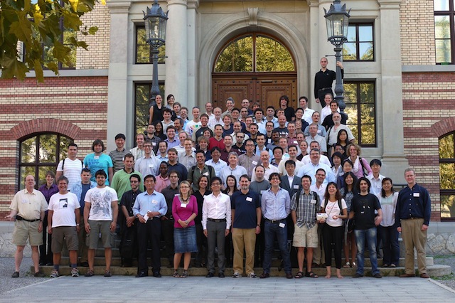 Click the image to view a larger version of the conference photo along with all the participants' names